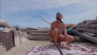 naked slave pig exposed in penis cage cruising at public beach in outfit to please master, BDSM CBT
